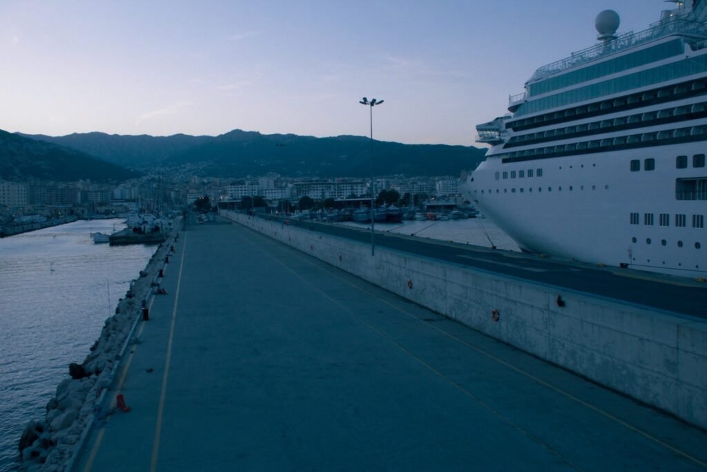 Cruise ship berthed at a Mediterranean port at dawn