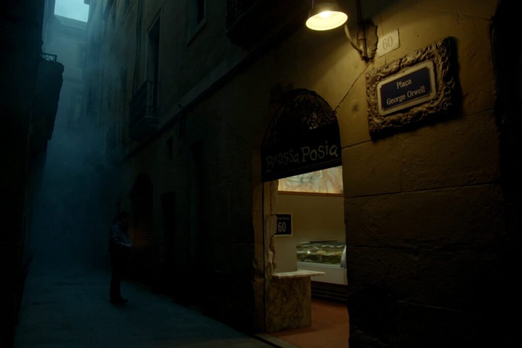 A narrow Gothic Quarter street in Barcelona at dusk