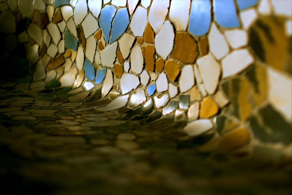 Close detail of the broken-tile mosaic bench at Park Güell