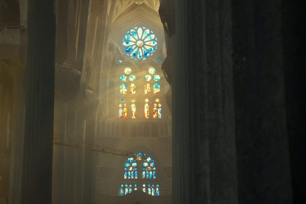 Morning light through the stained glass inside the Sagrada Família